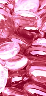 Vibrant pink glass pebble mobile wallpaper with sparkling highlights.