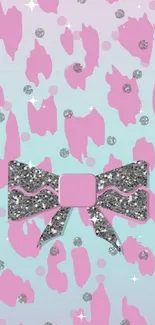 Mobile wallpaper with a pink glitter bow on pastel background.