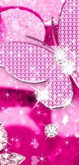 Glittery pink butterfly with diamonds on a vibrant pink background.