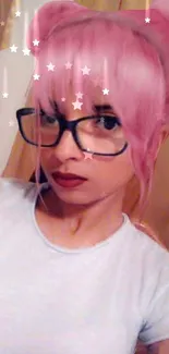 Portrait with pink hair and glasses, star overlay.