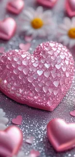Pink heart on glittery surface with daisies.
