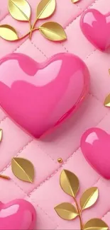 Glossy pink hearts and gold leaves on a pink quilted background.
