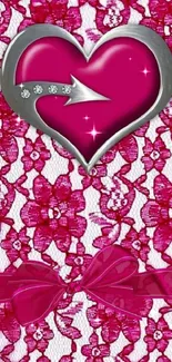 Pink heart with lace and gems on floral background.