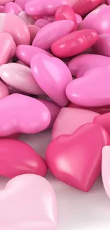 Pink heart-shaped candies scattered for a vibrant wallpaper.