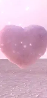 Floating pink heart cloud over a barren desert.