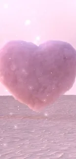 Pink heart-shaped cloud over a desert.