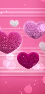 Fuzzy pink hearts on a pink background, perfect for romantic wallpapers.