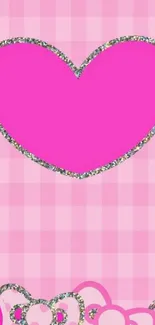 Pink heart with glitter on a checkered background wallpaper.