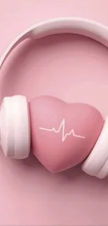 Pink heart-shaped headphones on a light pink background wallpaper.