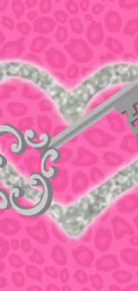 Pink leopard print wallpaper with glittery heart and silver key design.