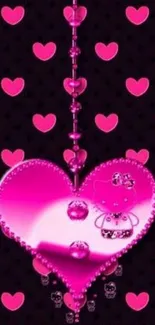 Charming pink heart mobile wallpaper with polka dots on black background.