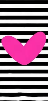 Bold pink heart on black and white striped background.