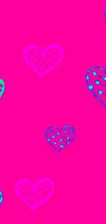 Vibrant pink wallpaper with heart patterns.