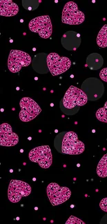 Pink heart pattern on black wallpaper.