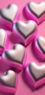 Glossy pink metallic hearts on a vibrant background.