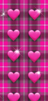 Mobile wallpaper with pink hearts on a plaid background.