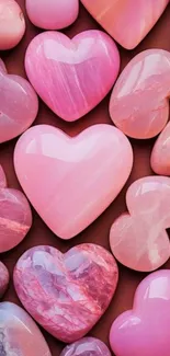 Pink heart-shaped stones wallpaper for mobile.