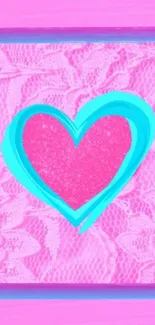 Vibrant pink lace wallpaper with teal heart.