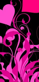 Pink floral hearts and swirls on black background wallpaper.