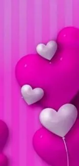 Vibrant pink wallpaper with heart design.