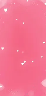 Pink hearts wallpaper with soft gradient background.