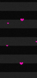 Pink hearts on a black dotted striped wallpaper for mobile.