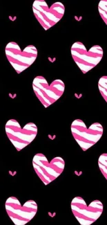 Vibrant pink hearts pattern on a black background for mobile wallpaper.