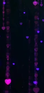 Pink and purple heart lights on a dark wallpaper.