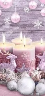 Pink candles with festive decor and snowflakes on a wooden backdrop.