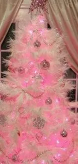 Illuminated pink Christmas tree smartphone wallpaper.