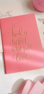 Pink inspirational wallpaper with elegant typography and decorative items.