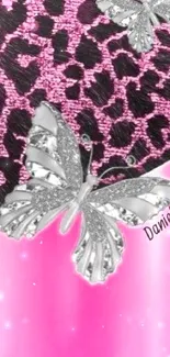 Pink leopard print wallpaper with silver butterflies.