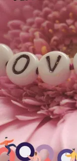 Pink flower with 'LOVE' bead design wallpaper.