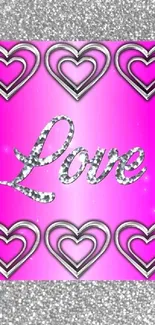 Pink wallpaper with silver hearts and 'Love' in stylish typography.