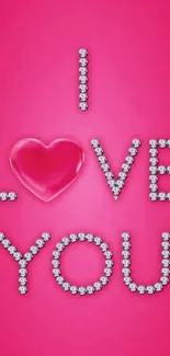 Pink wallpaper with 'I Love You' in jewels.