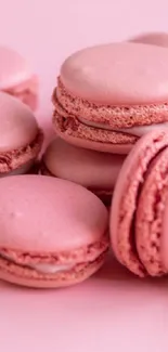 A delightful mobile wallpaper featuring pink macarons.