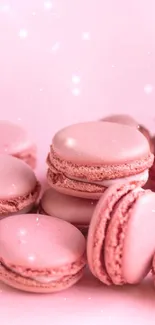 Aesthetic pink macaron wallpaper with soft pastel colors.