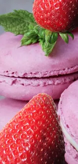 Pink macarons topped with strawberries and mint