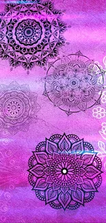 Pink mandala wallpaper with intricate patterns.