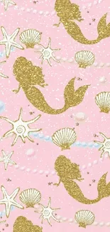 Pink wallpaper with golden mermaids and seashells.