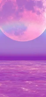 Pink moon over a purple ocean landscape wallpaper.