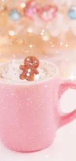 Pink mug with gingerbread cookie in cream surrounded by festive lights.