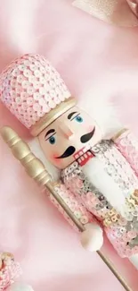 Decorative pink nutcracker surrounded by soft pastel hues.