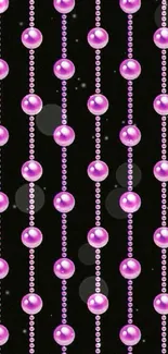 Luxurious pink pearl bead pattern on black background.