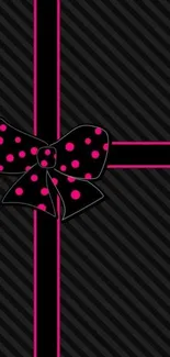 Stylish black mobile wallpaper with pink polka dot bow accent.