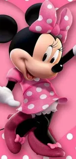 Cartoon character in pink polka dot outfit on wallpaper.