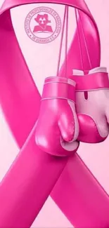 Pink ribbon with boxing gloves symbolizing strength and awareness.