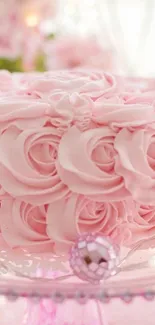 Delicate pink rose cake on a decorative stand.