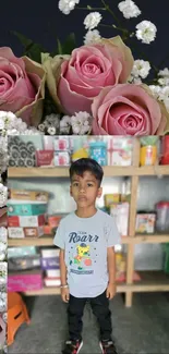 Wallpaper with pink roses and a young child.