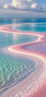Pink sandy beach with turquoise ocean under a blue sky